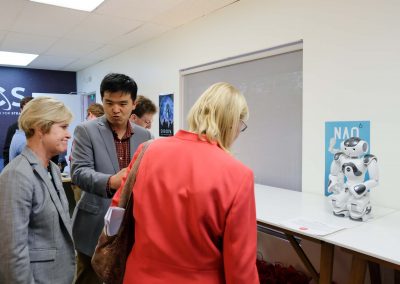 CSUN President Diane Harrison and Dr. Mary Beth Walker viewing the NAO robot