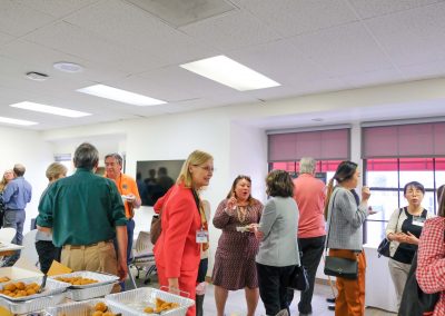 Attendees enjoying food and conversations