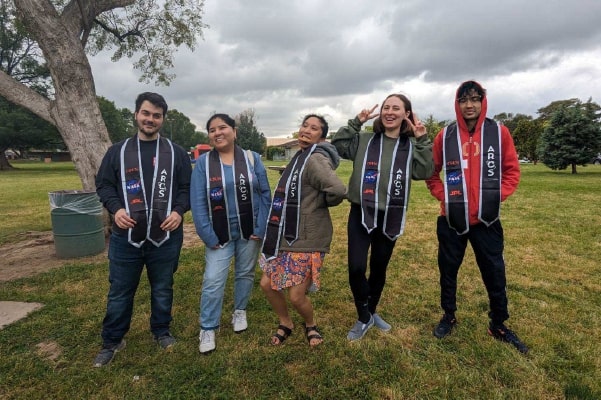ARCS students in group photo wearing sashes