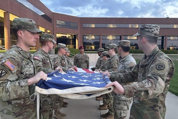 Image of US army soldiers folding US flag