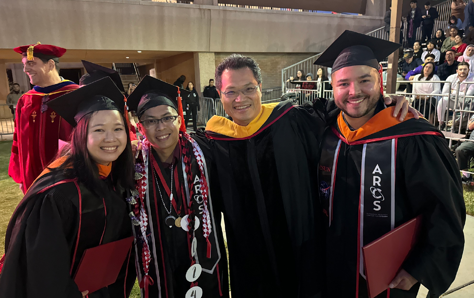 Image of Dr. Ho and graduating students