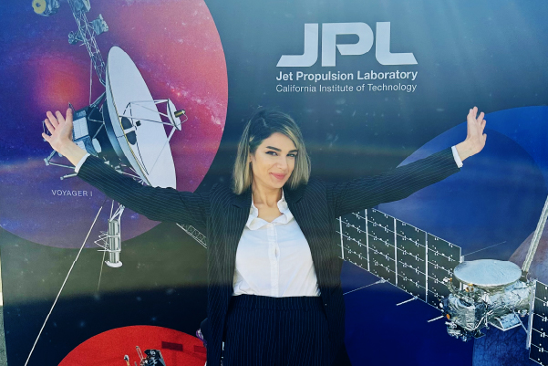 Image of Hariet Yousefi in front of JPL backdrop