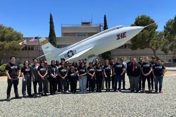 Image of ARCS team in front of aircraft